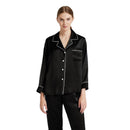 Black silk pajama set with white contrast piping on button-up top