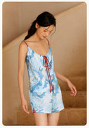 Lifestyle view of silk sleepwear set in soft natural lighting