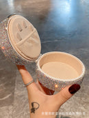 Interior compartment layout with labeled areas for earrings, necklaces, and rings