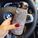 Tumbler arranged with holiday ornaments for Christmas gifting inspiration