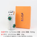 Top-down view of deep green tumbler with lid closed, highlighting matte finish