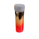 Lifestyle image of tumbler on desk next to laptop and notebook