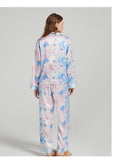 Packaging shot of the silk pajama set in a gift box with tissue paper