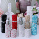 Top-down close-up of spray nozzle and metal collar on Lake Blue atomizer