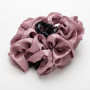 Lavender cloud clip paired with silver earrings and bare shoulders