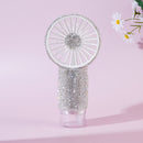 Front view of white handheld mist fan with crystal accents on white background