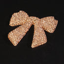 Purple bow rhinestone accent under studio lighting