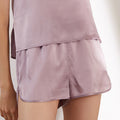 Mauve purple silk loungewear shorts side detail on model