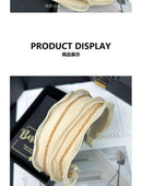 Hair band worn with low bun hairstyle demonstrating secure fit