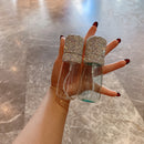 Flat lay with spray bottle, dropper, and linen towel — emphasizing clean, calming aesthetic