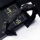 Black rhinestone hair band on white background, front view