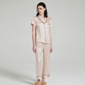 Light apricot silk pajama set featuring button front and long pants
