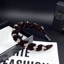 Side angle showing high-crown contour and crystal detail of coffee brown headband