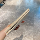 Mirror in soft ambient lighting to highlight white crystal sparkle and matte-gloss contrast