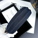 Close-up detail of stainless steel accent element on denim band